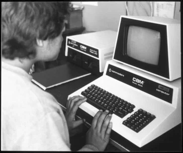 Image: Boy working on vintage Commodore computer