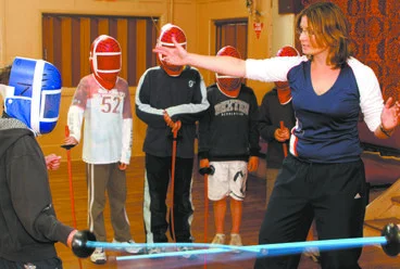 Image: Teacher and students fencing