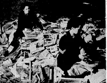 Image: Sorting periodicals collected by the postmen and others on Saturday* These books and periodicals were taken to the headquarters of the Country Library Service, where they are being packed to be sent to (Evening Post, 08 May 1945)