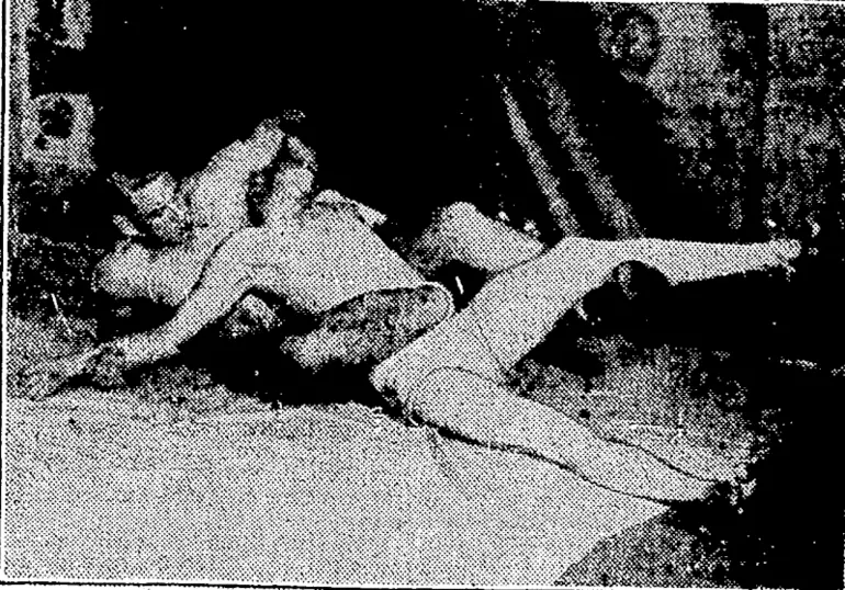 Image: LOFTY" BLOMFIELD, the Auckland professional wrestler, who '' has been meeting icith considerable success this season. Fie 'is hold. • ) ing a figure-four scissors and a head lock on a sparring'partner* '( \ ■ )■ (Evening Post, 31 August 1935)