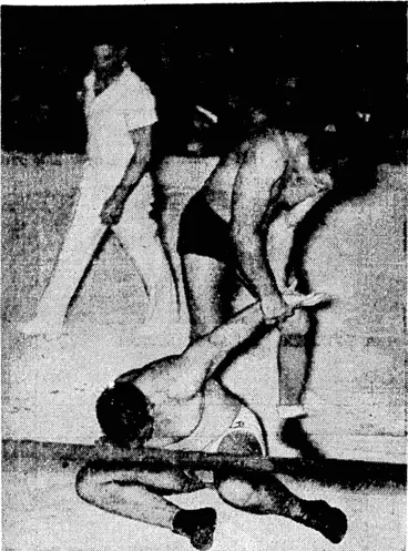 Image: Frank Judson endeavours to twist "Lofty" Blomfield's arm out <>I its socket during their match at the Town Hall. ".i...". : ■ ' – ■ (Evening Post, 11 September 1937)