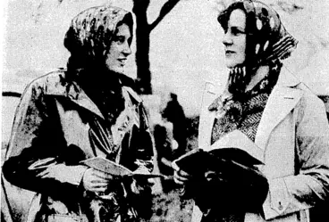 Image: Sport and General" Photo. Striking head-coverings worn by Miss Diana Severne one? the Hon. Legarde Phillips at the Cambridge University Steeplechase at Cottenham, England, on February 19. (Evening Post, 18 March 1937)