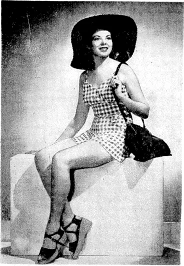 Image: Tablecloth check in royal blue and white rayon mixture fabric is used for this smart bathing suit. The crownless hat of rough straw, the rubber-lined beach bag, and the cork-soled clogs are all in deep blue colour. (Evening Post, 26 November 1938)