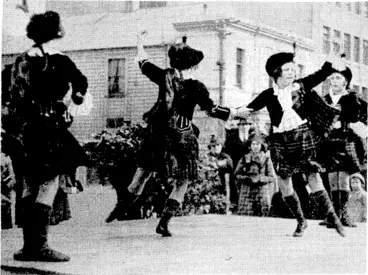 Image: Kvcning Po.st" X'lioto. Highland dancing in Courtcnay Place, yesterday, one of the activities in connection with a "street day" collection in aid of the uniform fund of the Wellington Company of the New Zealand. Scottish Regiment ■.and-.of-the Society for the Prevention of Cruelty to Animals. (Evening Post, 08 July 1939)