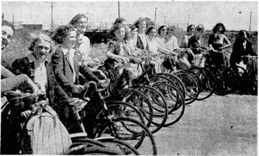 Image: Evening Post" Photo. Girls who last Saturday launched the new Women's Saturday Afternoon Cycle Club by a picnic trip on wheels from Wellington to Eastbourne and back. This photograph ivas taken at Petone on the way out. (Evening Post, 23 December 1939)