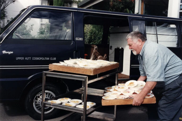 Image: Cosmopolitan Club; meals on wheels; Mike Redican loads desserts into the van.