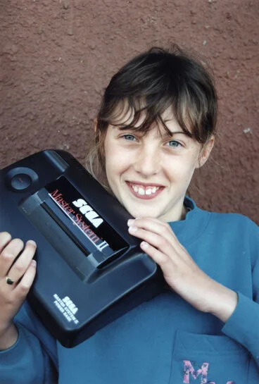 Image: Hershey's chocolate lover Charlene Crosby wins a Sega Master computer system.