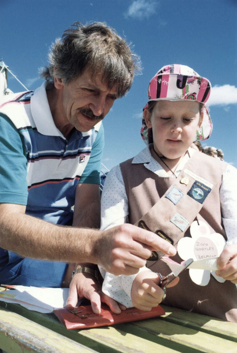 Image: Brownie Zara Wortley and dad Ken making paper plate flowers.