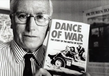 Image: Peter Bates with his book "Dance of War: The Story of the Battle of Egypt".