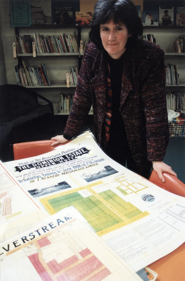 Image: Library display of old posters advertising subdivisions; Nicola Frean, archivist.