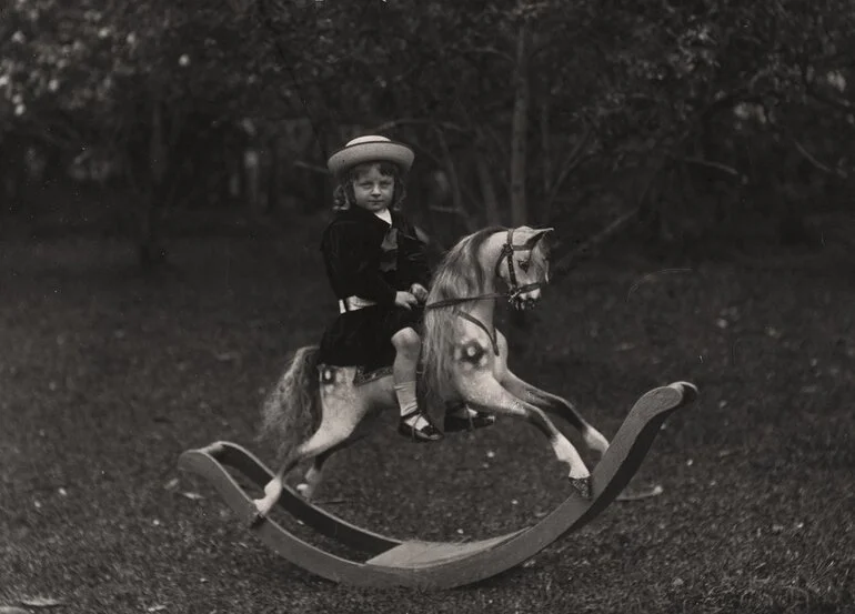 Image: Arthur Clifford's daughter, on wooden rocking horse.