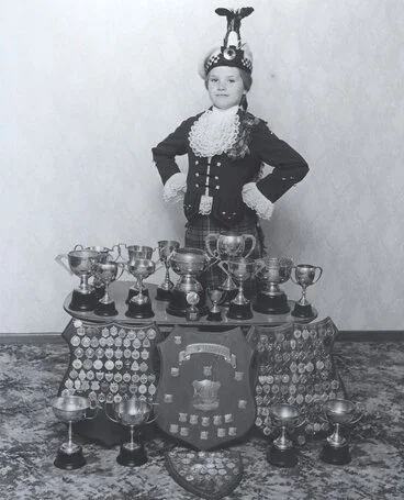 Image: Tracey Watson with Highland dancing trophies. [P3-307-1382]