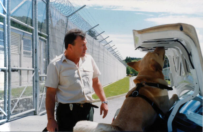 Image: Department of Corrections; drug-detection dog Nick and handler Barrie Gerbich