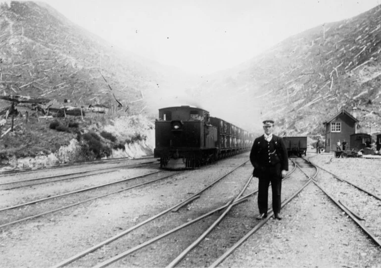 Image: Summit station; southbound stock train about to leave; guard in foreground.