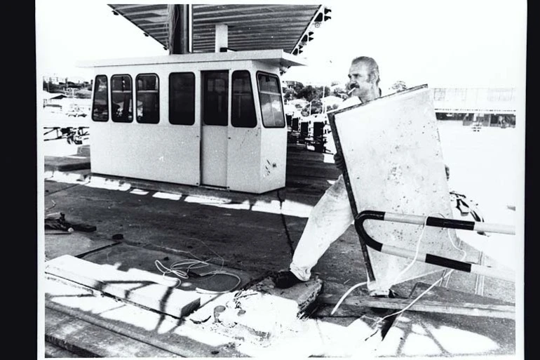 Image: Showing workmen demolishing? the toll booths on the Auckland Harbour Bridge, 1984?