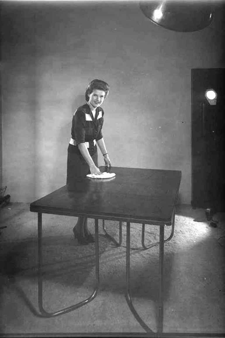 Image: Advertisement for Neopol Polish with Stephanie Nicholson polishing a table