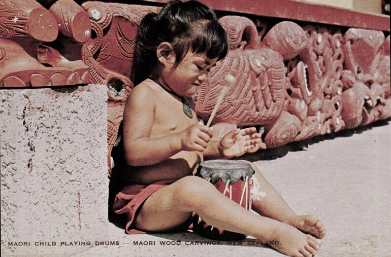 Image: Maori Child Playing Drums - Maori Wood Carvings, New Zealand