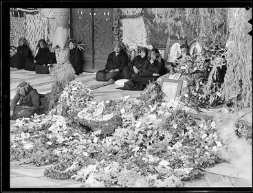 Image: Women on whare entrance with wreaths (3) & casket