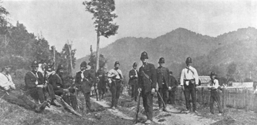 Image: A group of police sitting and standing on...