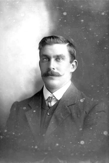 Image: 1/2 portrait of Mr Connell, who has a waxed moustache, in a....