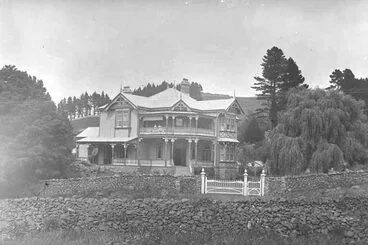 Image: Showing a double storied villa surrounded by trees and long....