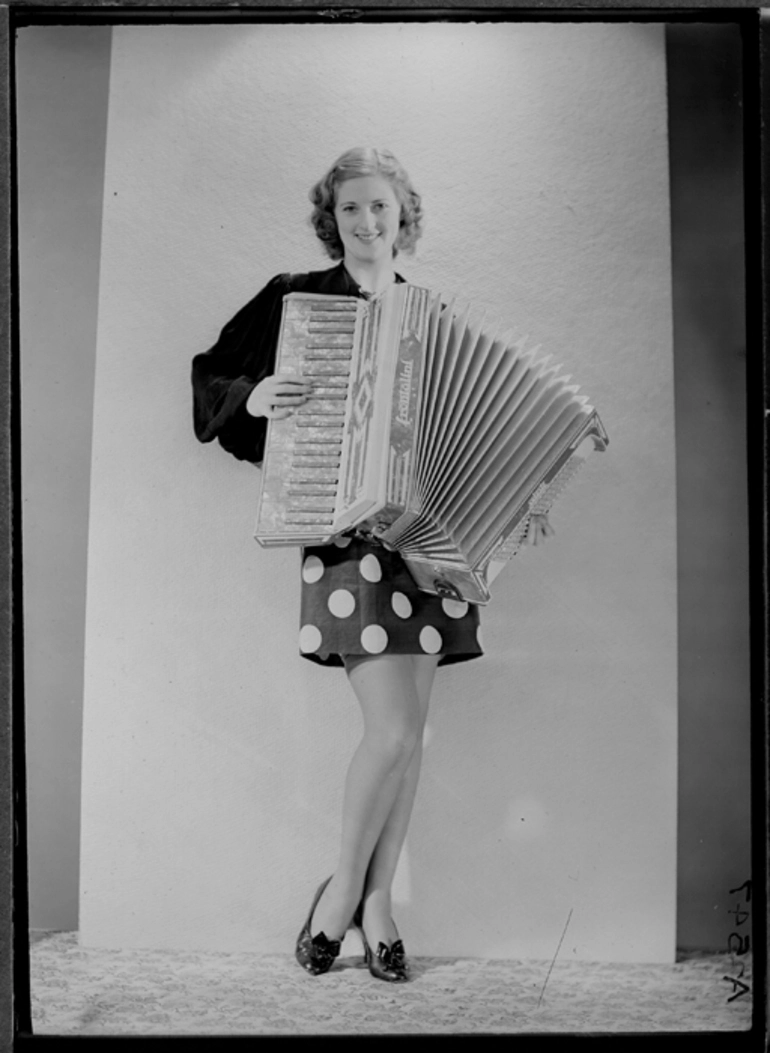 Image: Showing a models with an accordian for Atwaters Limited, 1940