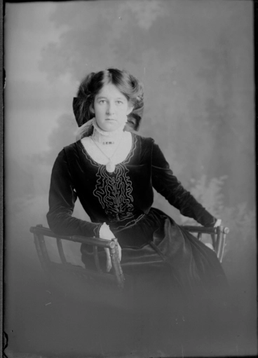 Image: 3/4 length portrait Miss Sandham, seated in a wooden chair,....