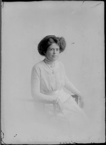 Image: 3/4 length portrait of Mrs Dyson, seated in a wooden chair,....