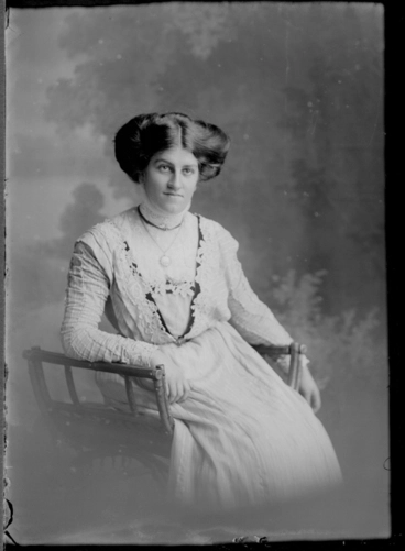 Image: 3/4 length portrait of Miss Donald, seated in a wooden chair,....