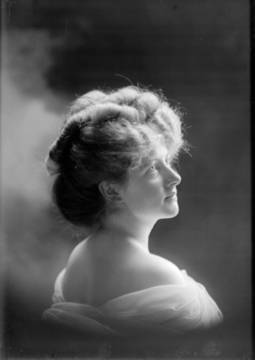 Image: 1/4 length profile portrait of Miss Grimmer with bare shoulders....