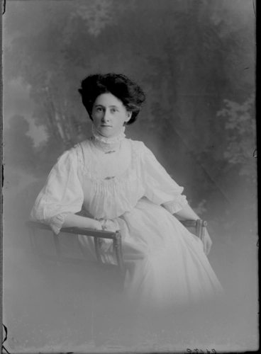 Image: 3/4 length portrait of Miss Kearney, seated in wooden chair,....