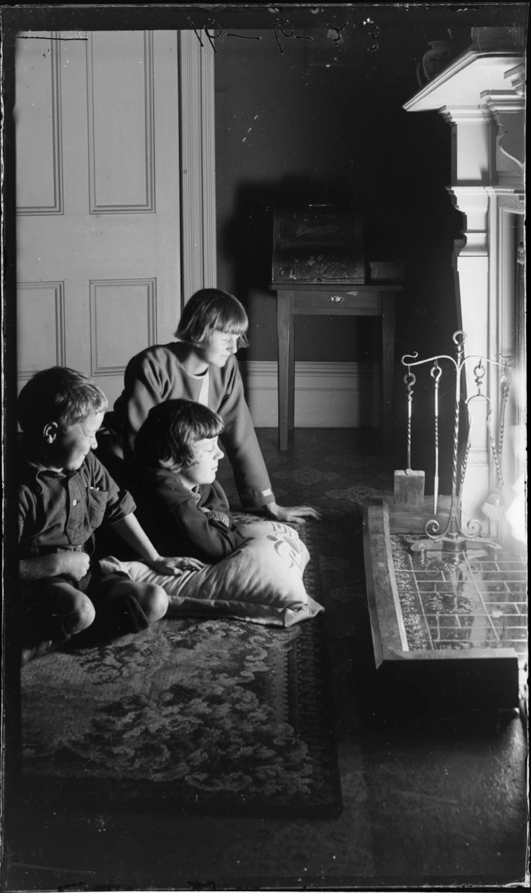 Image: Children in front of a fireplace