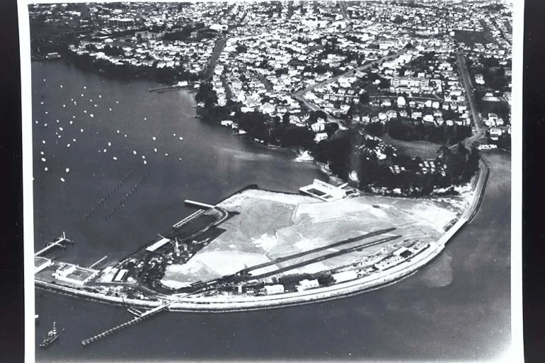 Image: Aerial view looking south east over Westhaven Boat Harbour showing preparations for the Auckland Harbour Bridge... 1955