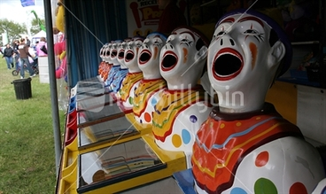 Image: Sideshow clowns with mouths open