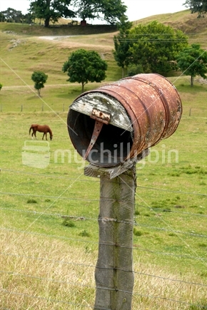 Image: Drum letterbox with horse in background