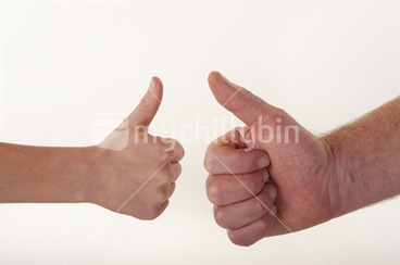Image: Hand shot of boy and man hands doing thumbs up against white background
