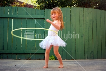 Image: Ella ballerina; does the barefoot hula, in her New Zealand backyard.