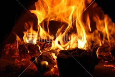 Image: Fire burning wood in the fire place.