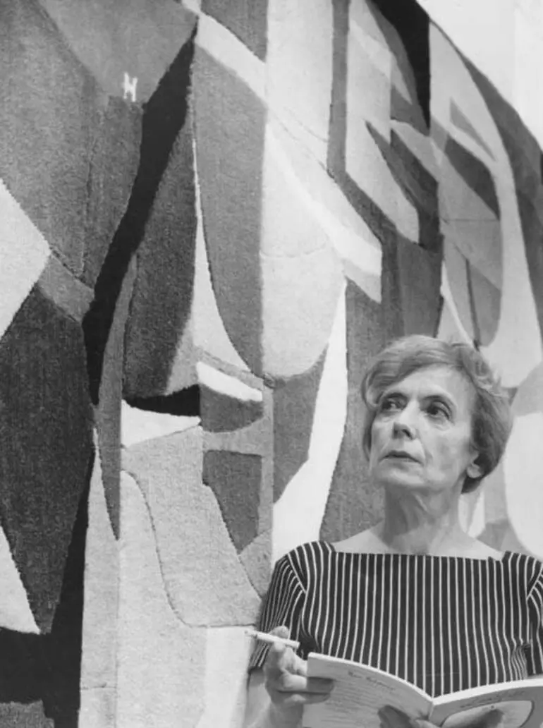 Image: Louise Henderson with the wool mural she designed for the Hilton Hotel, Hong Kong, in 1963