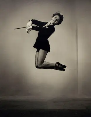 Image: (Female dancer jumping with baton?)