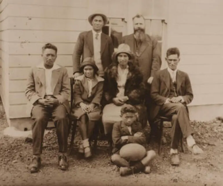 Image: (Group portrait of Gilbert Family with Father van Beek)