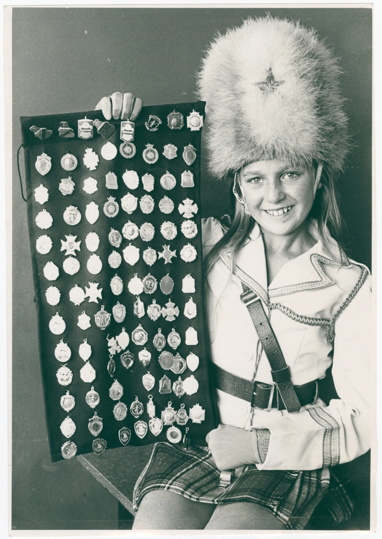 Image: Jackie Sibley, marching team leader, with medals