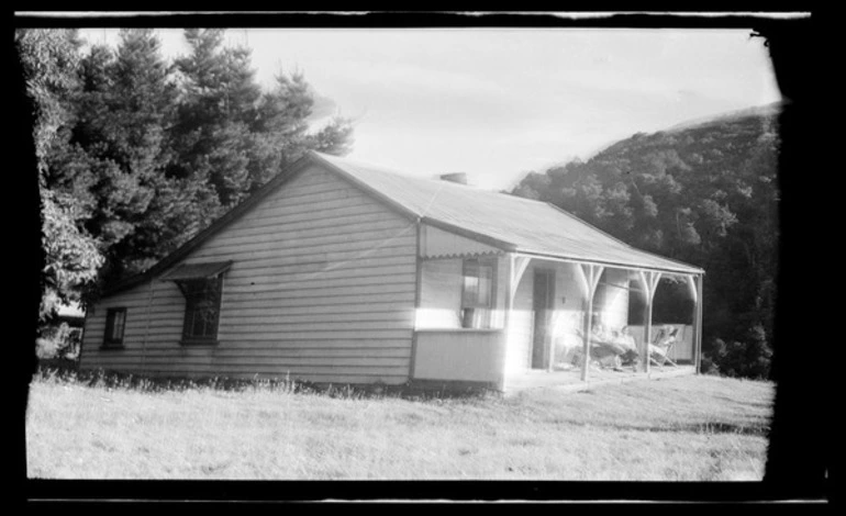 Image: Three people sitting on a veranda