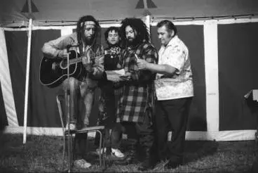 Four performers with guitar, Parihaka Concert Image: Four performers with guitar, Parihaka Concert