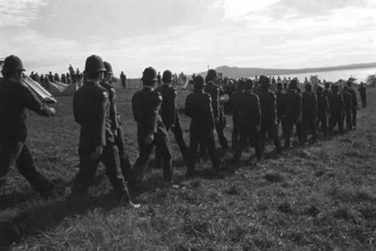 Image: Police march on to site. Orakei Bastion Point Occupation