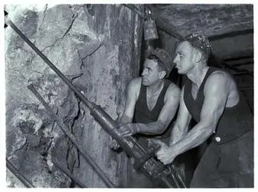 Waihi - Two miners work inside mine. Image: Waihi - Two miners work inside mine.