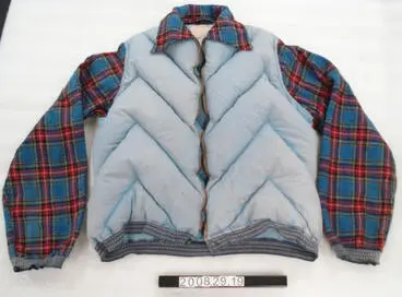 Fairydown jacket with tartan woollen sleeves and collar Image: Fairydown jacket with tartan woollen sleeves and collar