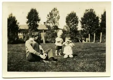 Image: Photograph, Black and White: Colin Lovell-Smith sitting on a lawn with his sons Richard and John