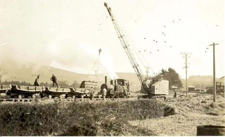 Image: Wilsons (NZ) Portland Cement Co Ltd: 1949 crane loading train, Portland, Whangarei, Northland