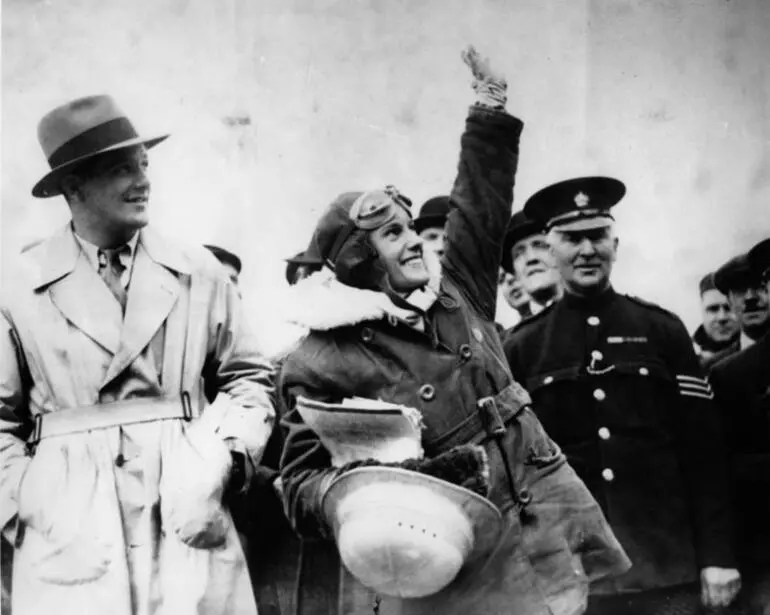 Image: Jean Batten waving to supporters after arrival in Croydon